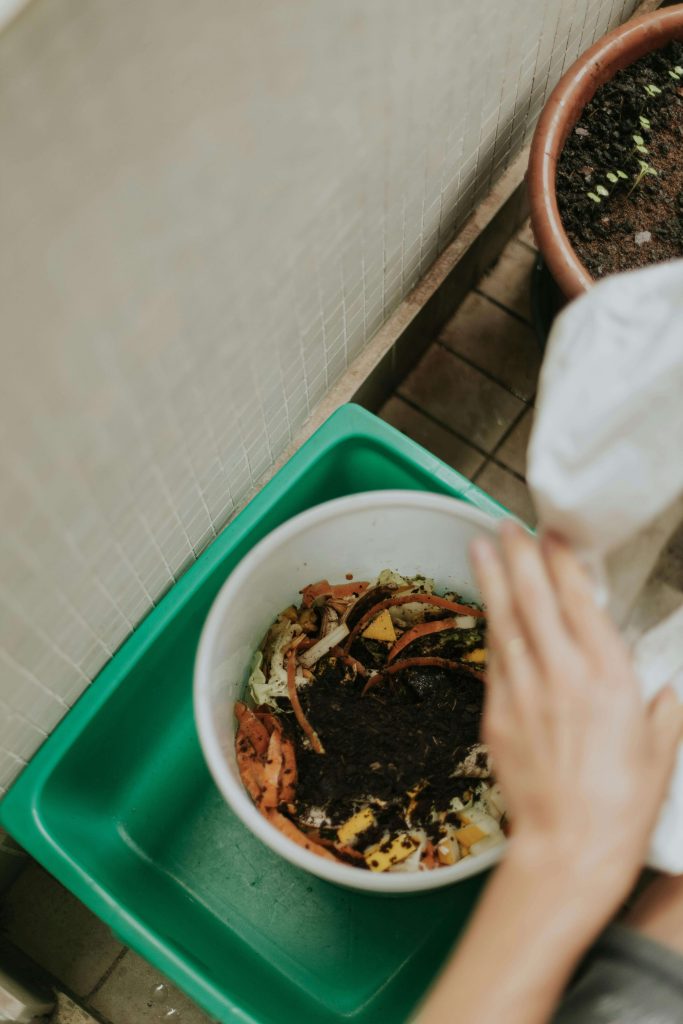 Simple DIY compost bin made from recycled plastic bucket.